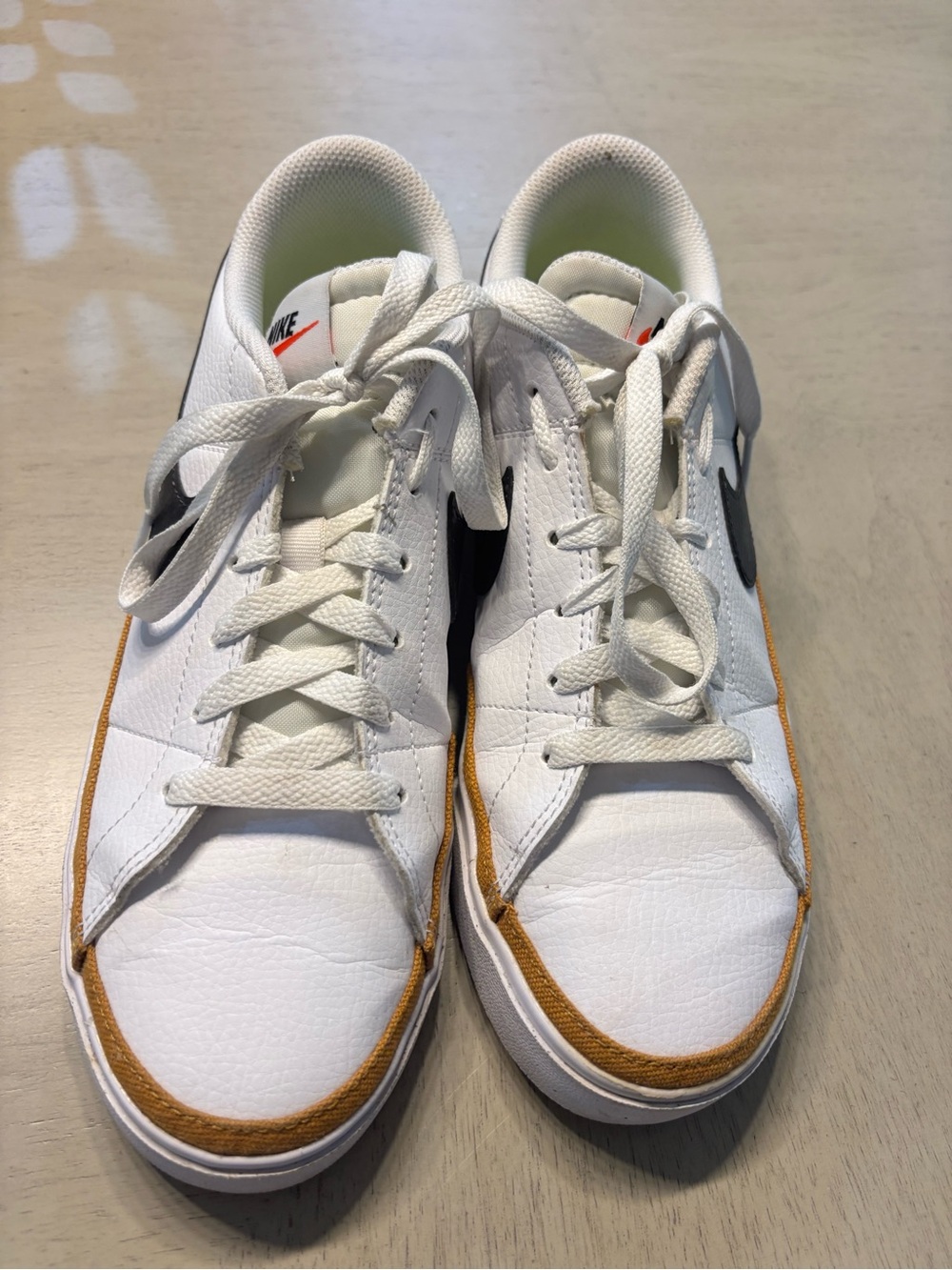 Nike Women’s White Sneakers with Black Swoosh and Brown Trim